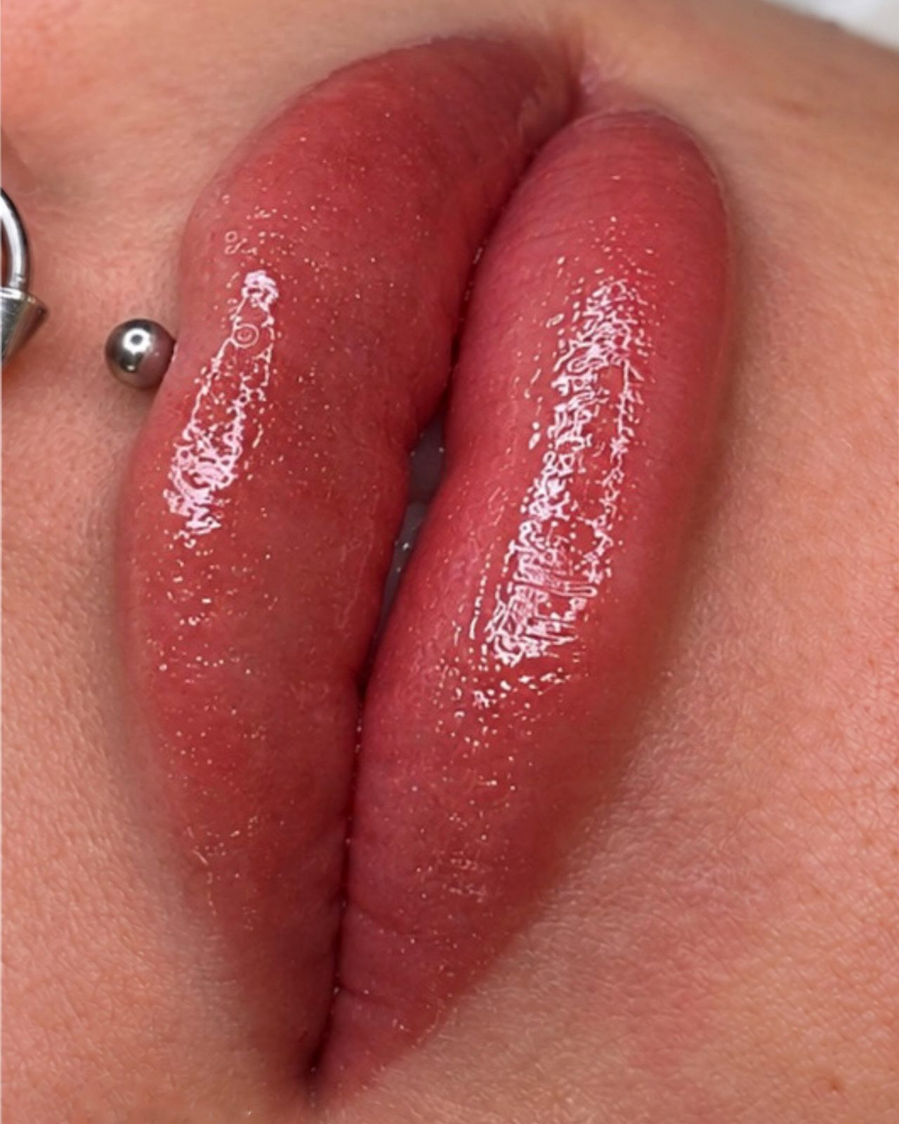 Russian lip tint result: glossy, evenly tinted natural pink lips